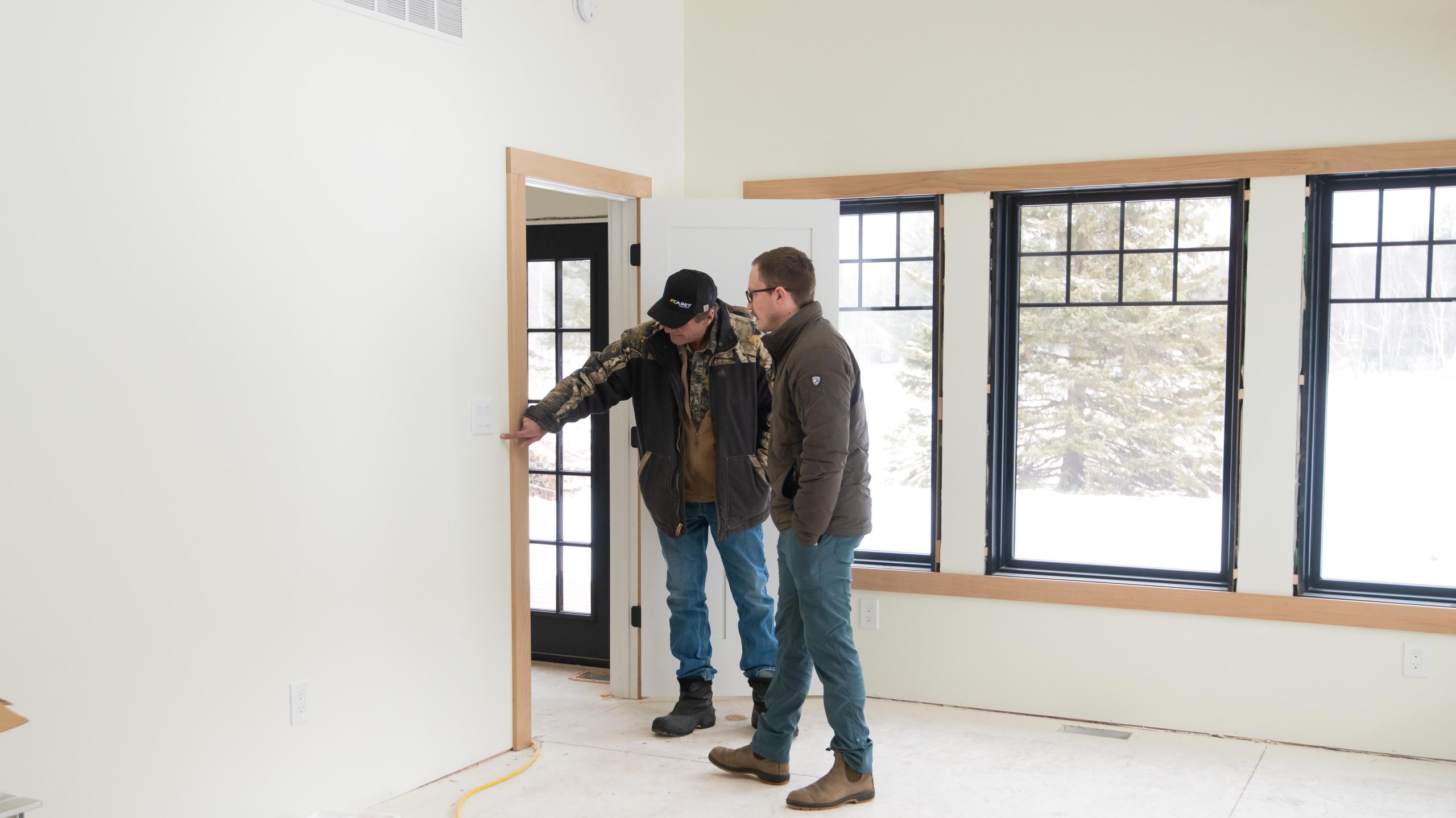 Luke Carey inspecting home build process